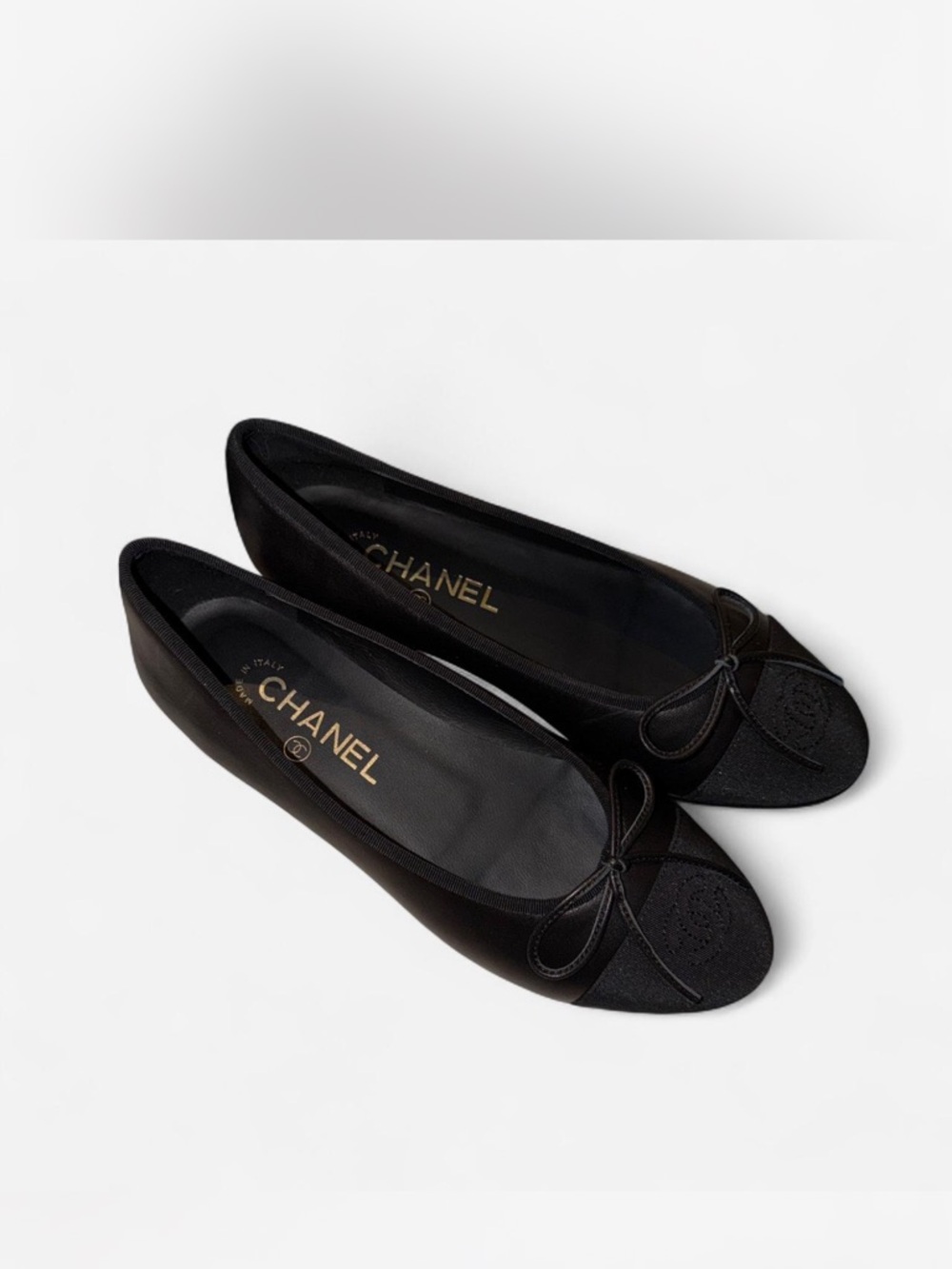 CHANEL Black Leather Ballet Flats with Bow and CC Cap Toe